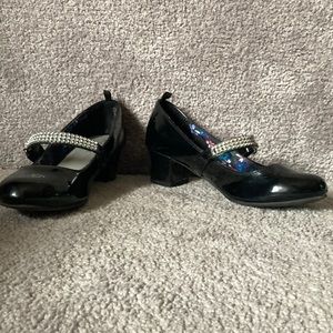 Black girls patent leather dress shoes with heel.